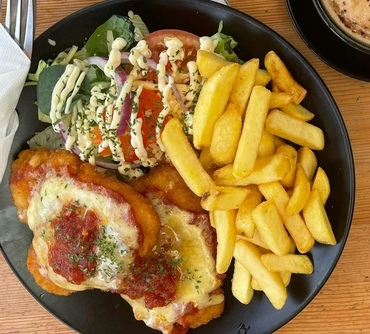 Harry’s chicken parmy with chips and salad